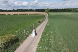 swancar farm country house wedding photography long drive bride groom portrait by drone